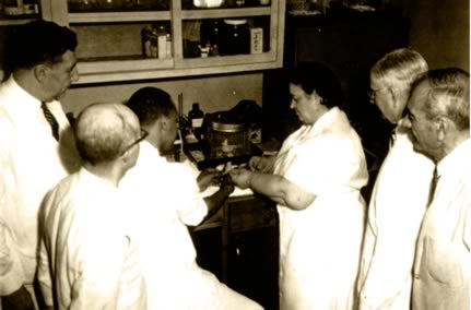 Rene Caisse and Dr Brusch in Lab with other Doctors